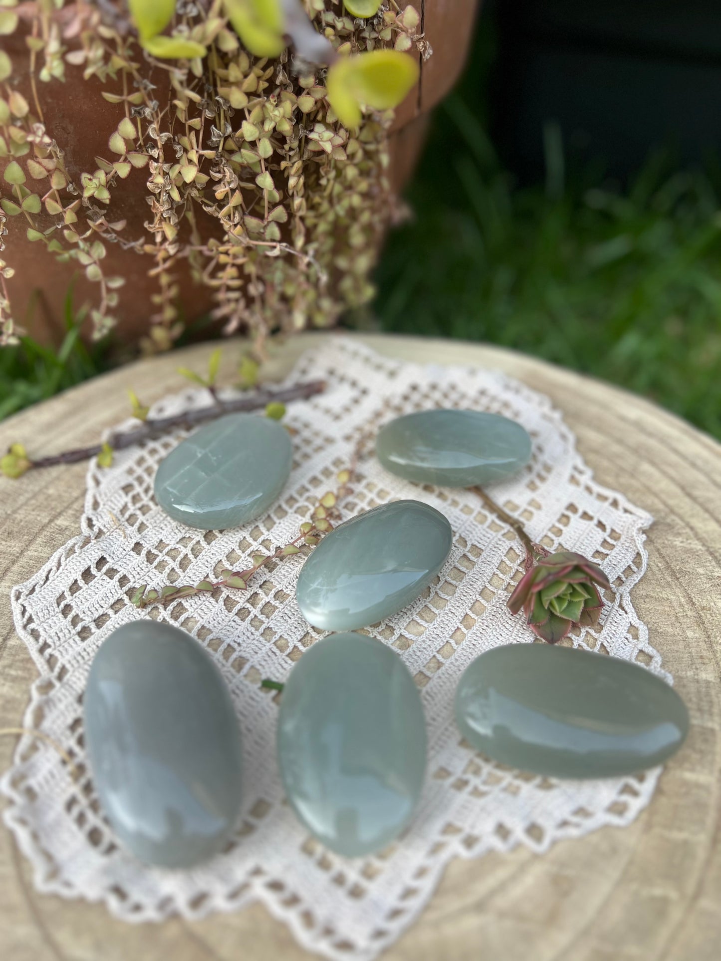Green moonstone palm stones
